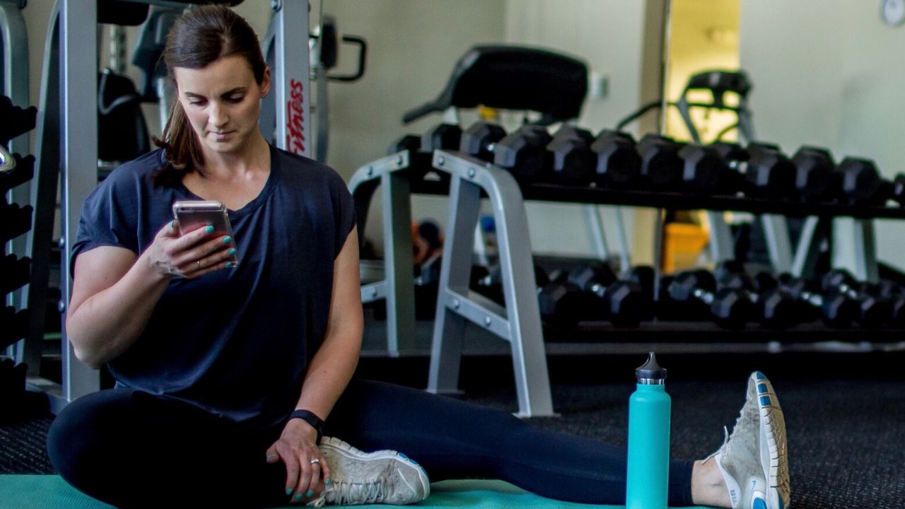 Fit Life Champions member doing a dumbbell press